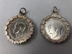 Two Half Crowns in Silver mounts