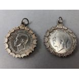 Two Half Crowns in Silver mounts