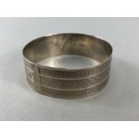 Baptismal Silver bracelet with engine turned decoration and marked "SILVER"