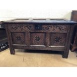 Three panelled oak coffer with carved detailing, approx 107cm x 49cm x 61cm tall