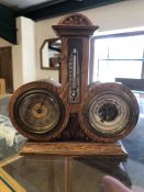 Interestingly shaped clock / barometer / thermometer in a wooden case