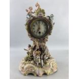 Large Ceramic ornate clock with Cherubs, blue makers mark to base (approx 40cm tall), A/F