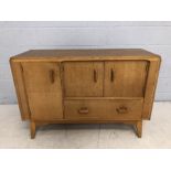 Small G-Plan sideboard with three cupboards and one drawer under with built in tea tray, approx