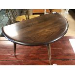 Circular low Ercol table with drop leaf