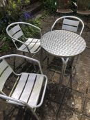 Metal garden table and three chairs