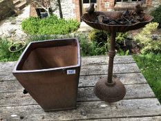 Cast iron bird bath and a garden planter