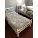 Pair of wooden single white painted beds