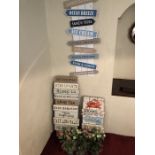 Collection of seaside themed decorative interior signs and artificial ornamental pot plants