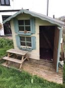 Children's' wooden outdoor playhouse with deck area and picnic bench (to be dismantled and collected