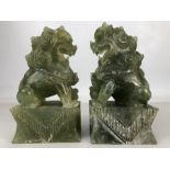 Pair of green stone foo dogs / temple dogs, approx 15cm in height (A/F)