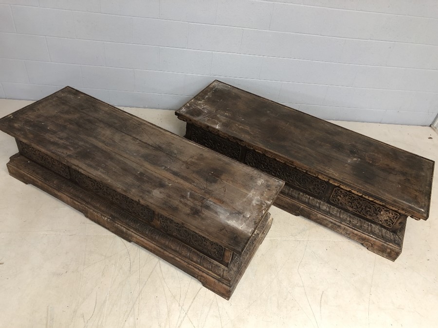 Pair of large, low heavily carved Chinese tables, each approx 177cm x 61cm x 45cm tall