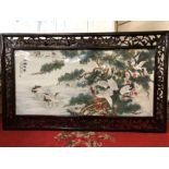 Large painted porcelain plaque depicting cranes with Chinese writing and character marks, mounted in