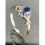 9ct white Gold ring size M set with a dark blue stone