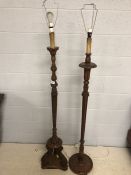 Two carved wooden standard lamps, the tallest approx 141cm to top of wooden base