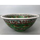 Mid 20th century Chinese bowl on green ground with dragons and flaming pearls red character mark