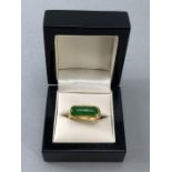 Gold ring marked 9999/6666 and 'SK' set with a large green stone possibly Jade (Chinese) size 'S'