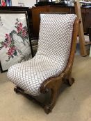 Antique upholstered low wooden framed nursing chair