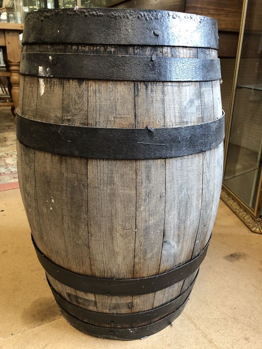 Wooden barrel with metal banding, approx 63cm in height