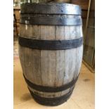 Wooden barrel with metal banding, approx 63cm in height