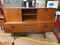 G-Plan red label sideboard, three drawers to centre, sliding cupboard and drinks cabinet over,