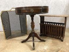 Leather topped drum table with a brass inlaid arts and crafts style magazine rack and a brass fire