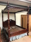 Modern heavily carved king size four poster bed, approx 160cm wide, no mattress