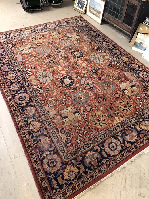 Large red/orange ground carpet with floral design, approx 340cm x 240cm