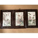 Three Chinese painted porcelain plaques depicting birds and flowers with Chinese writing and