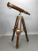 Small wooden telescope with brass fittings on tripod stand