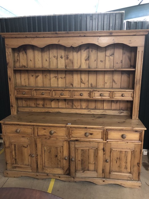 Large pine kitchen dresser with multiple drawers and cupboards under, approx 184cm x 48cm x 193cm