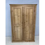 Antique pine two door wardrobe with hanging section to left and shelving to right