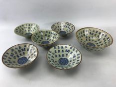 Collection of Chinese crackle glaze bowls and decorated all over with Chinese characters and six