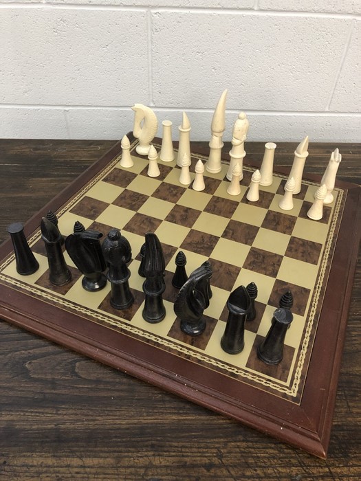 Chess set with soap stone pieces on a wooden board, approx 52cm x 52cm