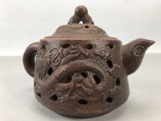 Chinese Yixing Clay teapot with Oval impressed marks to base. Outer shell has pierced decoration