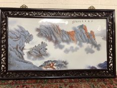 Large painted porcelain plaque depicting a mountainous scene with Chinese writing and character