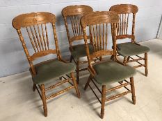 Set of four pine country cottage style stick back dining chairs with upholstered seats