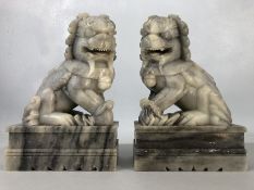 Two large carved marble foo dogs / temple dogs, approx 25cm in height