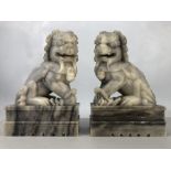 Two large carved marble foo dogs / temple dogs, approx 25cm in height