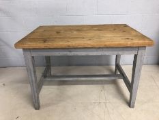 Small pine topped kitchen table with painted legs, approx 115cm x 74cm x 76cm tall