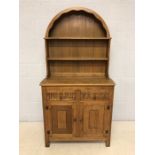 Small oak dresser with arched top and linen fold detailing to cupboards