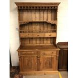 Pine kitchen dresser with carved detailing, drawers and cupboard under, approx 122cm x 51cm x