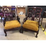 Pair of Chinese heavily carved low armchairs, each approx 63cm wide x 95cm tall x 57cm deep