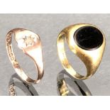 Two 9ct gold rings one set with an Onyx size 'F' and the other with a star set Diamond 'J' (approx