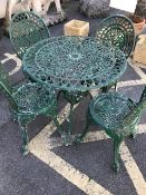 Garden table and chairs: An Aluminium lightweight circular table and four chairs