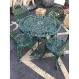 Garden table and chairs: An Aluminium lightweight circular table and four chairs