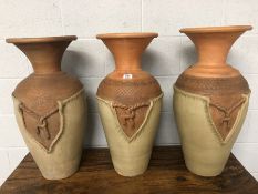 Three Ceramic Eastern urns, each approx 70cm in height