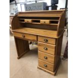Pine bureau with tambour front and five drawers under