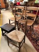 Pair of wooden chairs and a rush seated oak child's chair with small oak side table