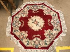 Hexagonal red ground Chinese rug, approx 110cm wide