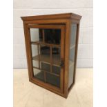 Glazed wooden hanging cupboard with single door and two internal shelves